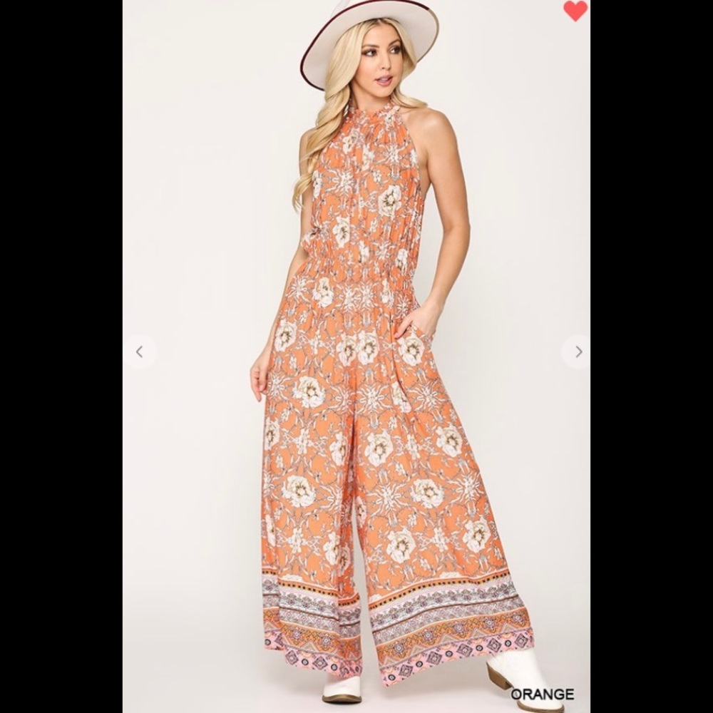 Floral print halter tie neck wide leg jumpsuit.